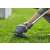 Gardena ComfortCut P4A 23/18V Cordless Grass Trimmer in use, cutting grass