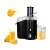 Adler AD 4127 black juicer with a glass of orange juice and an orange