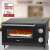 Clatronic MPO 3520 Multifunctional Pizza Oven with pizza inside, showing award