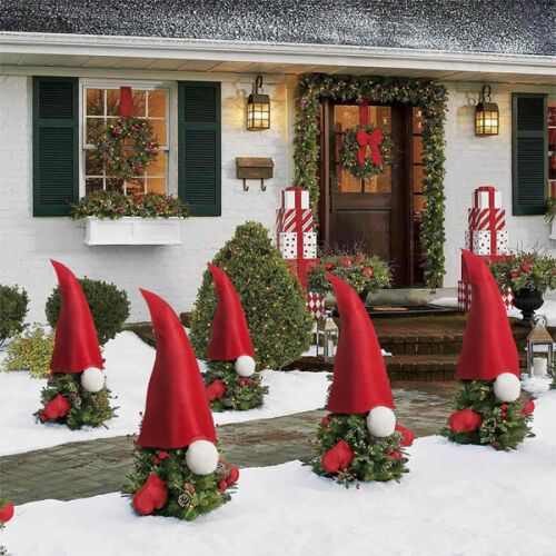 Christmas Gnome Decorations on Outdoor Plants in Winter Setting