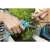 Woman using Gardena 8707-20 Balcony Pruning Shears to trim flowers