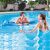 Couple relaxing on a blue Bestway inflatable beach mattress in a pool