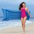 Woman carrying a blue Bestway inflatable beach mattress on the beach