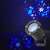 Nedis Decorative LED Snowflake Projector projecting snowflakes on a wall