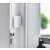 Shelly BLU Door/Window Sensor installed on a white door, smart home security, door and window opening detection