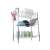 Three-tier dish drying rack with cutlery holder and cutting board holder, filled with dishes