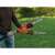 Black & Decker PS7525-QS Electric Pole Saw, 800W, Orange-Black, being used to trim branches
