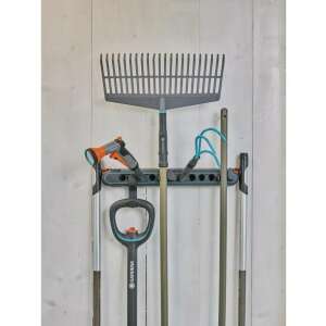 Gardena Combisystem wall mount tool holder with various gardening tools attached - Gardena