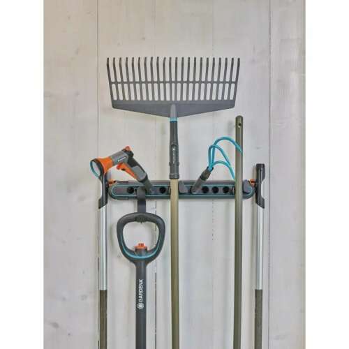Gardena Combisystem wall mount tool holder with various gardening tools attached
