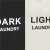 Close-up of 'Dark' and 'Light' Labels on Springos Laundry Basket