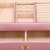 Springos jewelry box, pink, with gold accents, open, showing interior compartments and drawers, close-up