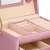 Springos jewelry box, pink, with gold accents, open, showing interior compartments and drawers, close-up