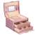 Springos jewelry box, pink, with gold accents, open, showing interior compartments and drawers