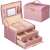 Springos jewelry box, pink, with gold accents, open, showing interior compartments and drawers