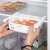 Springos refrigerator organizer, white, plastic, pull-out, expandable, for fridge, in use