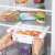 Springos refrigerator organizer, white, plastic, pull-out, expandable, for fridge, in use