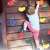 Child climbing a wall with Springos climbing holds