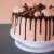Cake decorated with chocolate and marshmallows on a cake turntable
