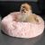 Pomeranian lying on Springos pink plush donut dog bed S size 60cm