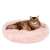 Pink Springos donut dog bed with a cat laying in it