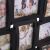 Close-up of Springos black 18 photo frame with family photos