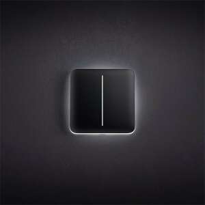 Ajax LightCore smart light switch with illuminated button, mounted on wall - Ajax