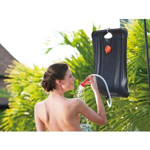 Woman using Bestway Solar-Pro 20L camping shower outdoors - Bestway