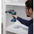 Carpenter installing drawer slides with Bosch GSR 185-LI Cordless Drill Driver