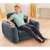 Person sitting in the Intex 2-in-1 inflatable armchair, gray