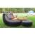 Man relaxing in Intex Ultra Lounge Relax inflatable chair with footrest in the garden