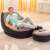 Man relaxing in Intex Ultra Lounge Relax inflatable chair with footrest