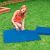 Intex pool foam mat being assembled on grass for pool protection