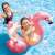Intex Glitter Flamingo Tube, inflatable pool float with glitter, pink, kids using it in a pool