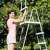 Intex 122cm Safety Pool Ladder, gray, 4 steps, for above ground pools, woman using the ladder