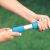 Close-up of hands adjusting the telescopic pole of the Intex pool cleaning kit