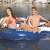 Two people relaxing on the Intex River Run 2-person inflatable raft with cooler