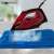 Clatronic DB 3752 steam iron in use, red and black, 2200W