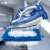 Clatronic DB 3706 blue cordless iron steaming a towel