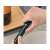 Hand holding a green pneumatic wine opener