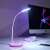 White LED desk lamp with adjustable arm and color changing base, perfect for reading, studying, or as a night light