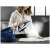 Woman using Tefal GV9812E0 Pro Express Vision steam generator iron
