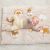Baby lying on Nattou Charlie plush play mat