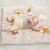 Baby lying on Nattou Charlie plush play mat