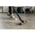 Close up of Karcher WD 2 Plus vacuum cleaner cleaning dirt on concrete floor
