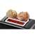 Bosch DesignLine black toaster with bread rolls on the warming rack.