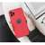 Forcell Soft red silicone case for iPhone 15 in hand