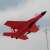 iUni FX820 remote control airplane, SU-35 model, red, in flight