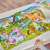 Child putting together Orchard Toys Unicorn Friends 50 piece jigsaw puzzle