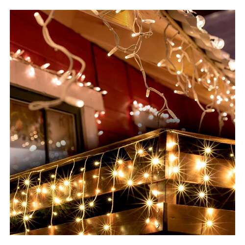 Home by Somogyi KKF 608/WW warm white LED icicle lights decorating a house