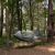 Springos gray hammock with mosquito net in forest setting